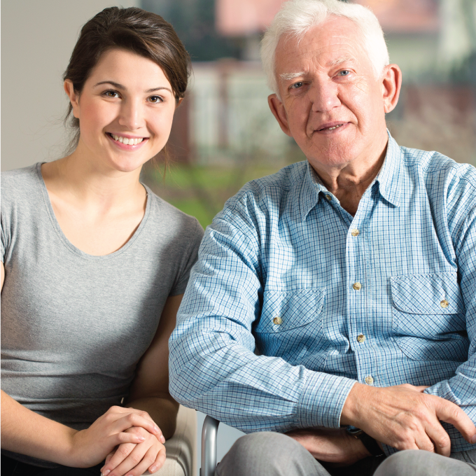 elderly man with nurse caregiver