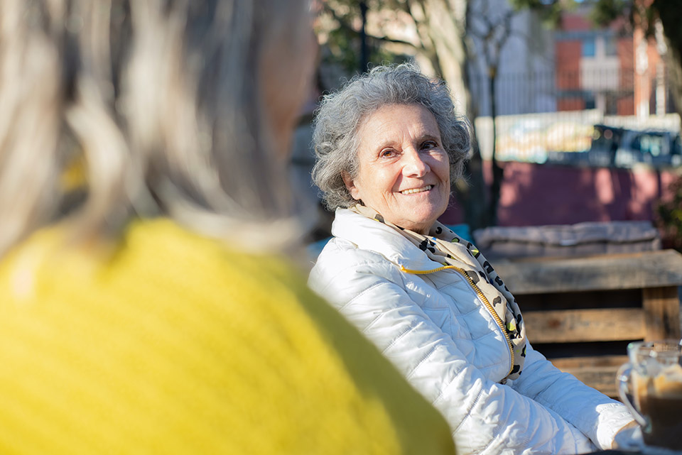 Senior Woman on Park Bench with Friend